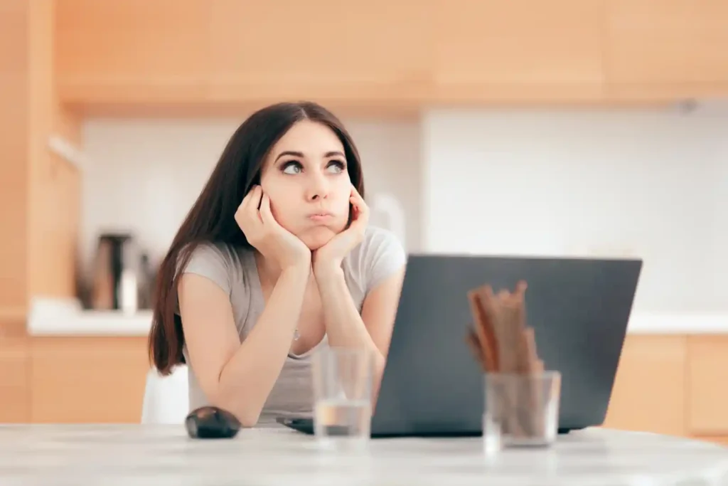 A young woman is thinking about how to solve problems encountered during international travel when it's solo trip.