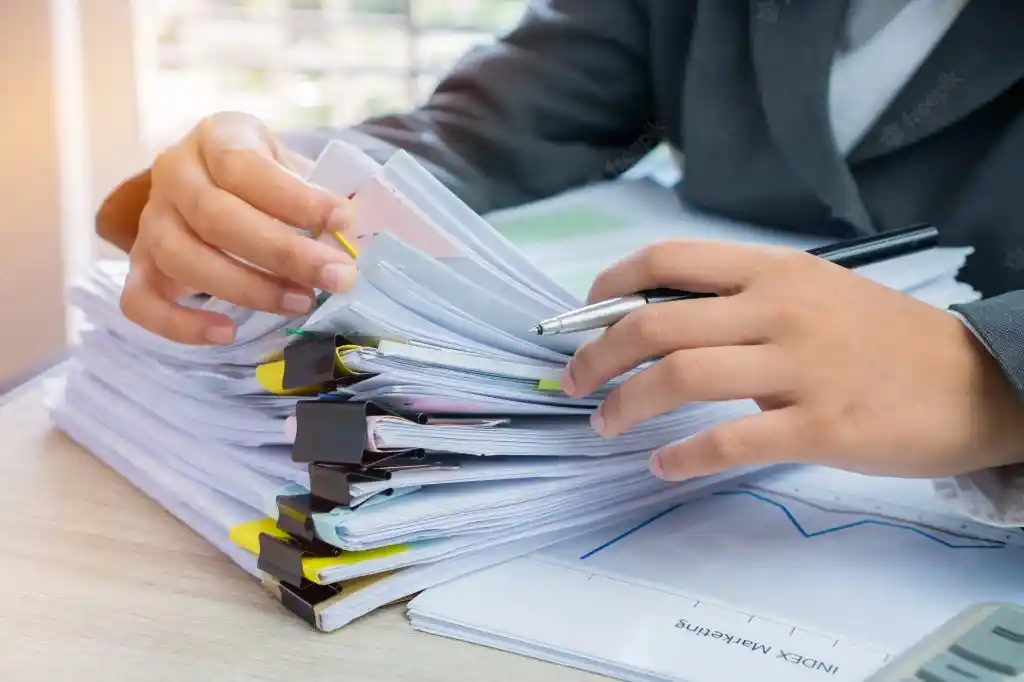 The visa officer is reviewing the Chinese visa application materials.