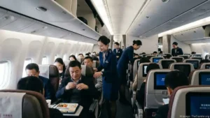 crew member inside the plane, who has a C visa, stewards entertaining the plane passengers.