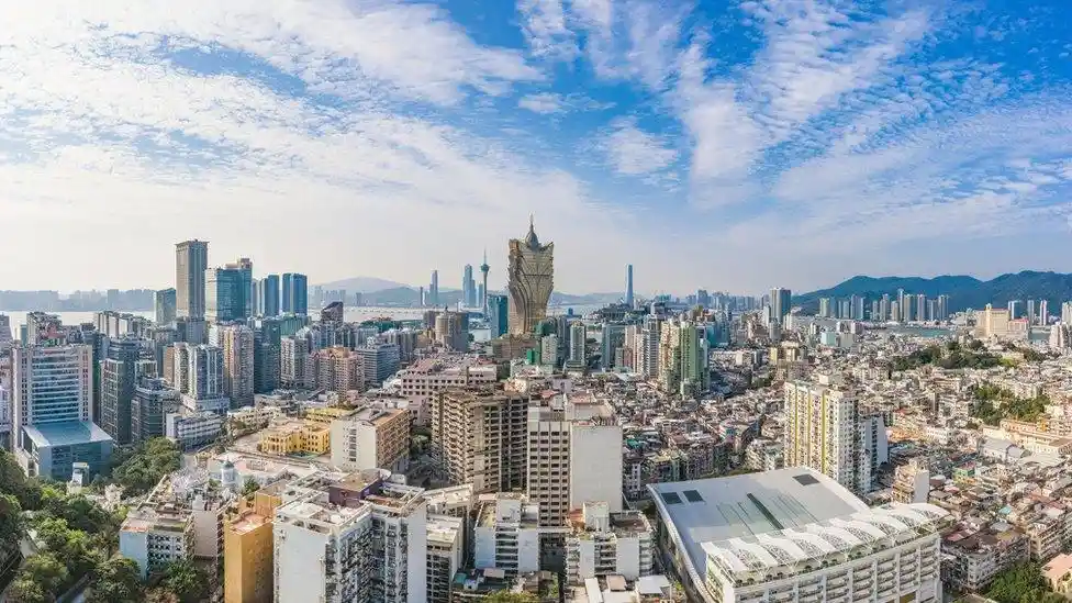view of some city in Macau, having a tall building