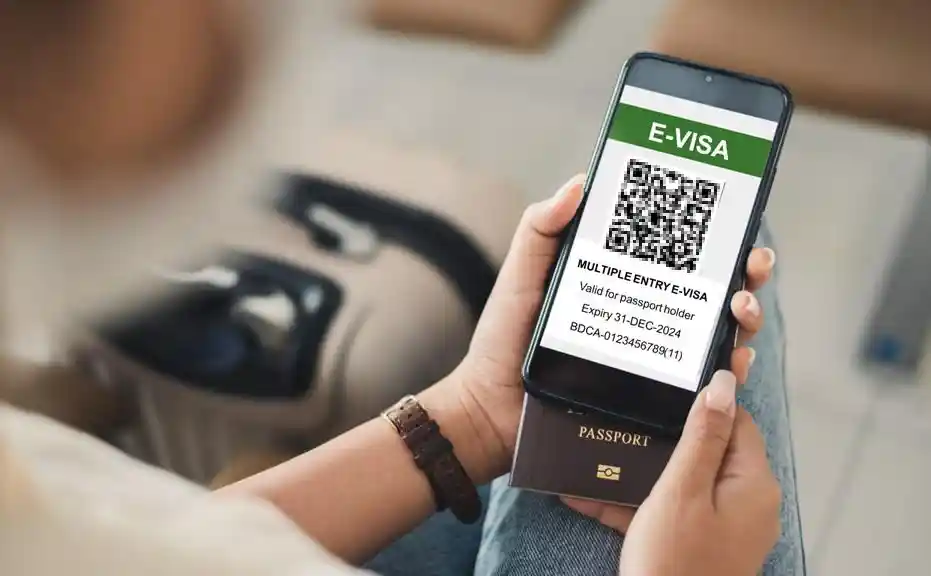 An e-visa is displayed on a person's phone, which also represents the future of visa digitalization for the Chinese visa.
