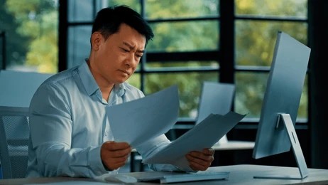 A man is nervous about his offload ticket at the airport, given by immigration and customs